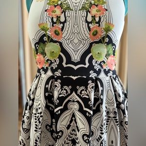 Elegant and versatile dress featuring a back zipper for easy wear.